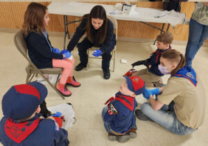 Scouts watch a safety demonstration.