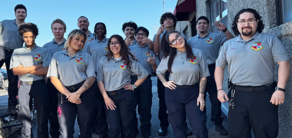 Graduates of Academy South pose for group photo.