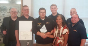 Group shot including Empress paramedics receiving award