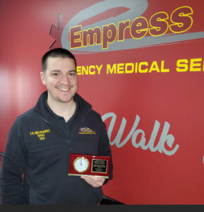 Timothy Morano poses with award