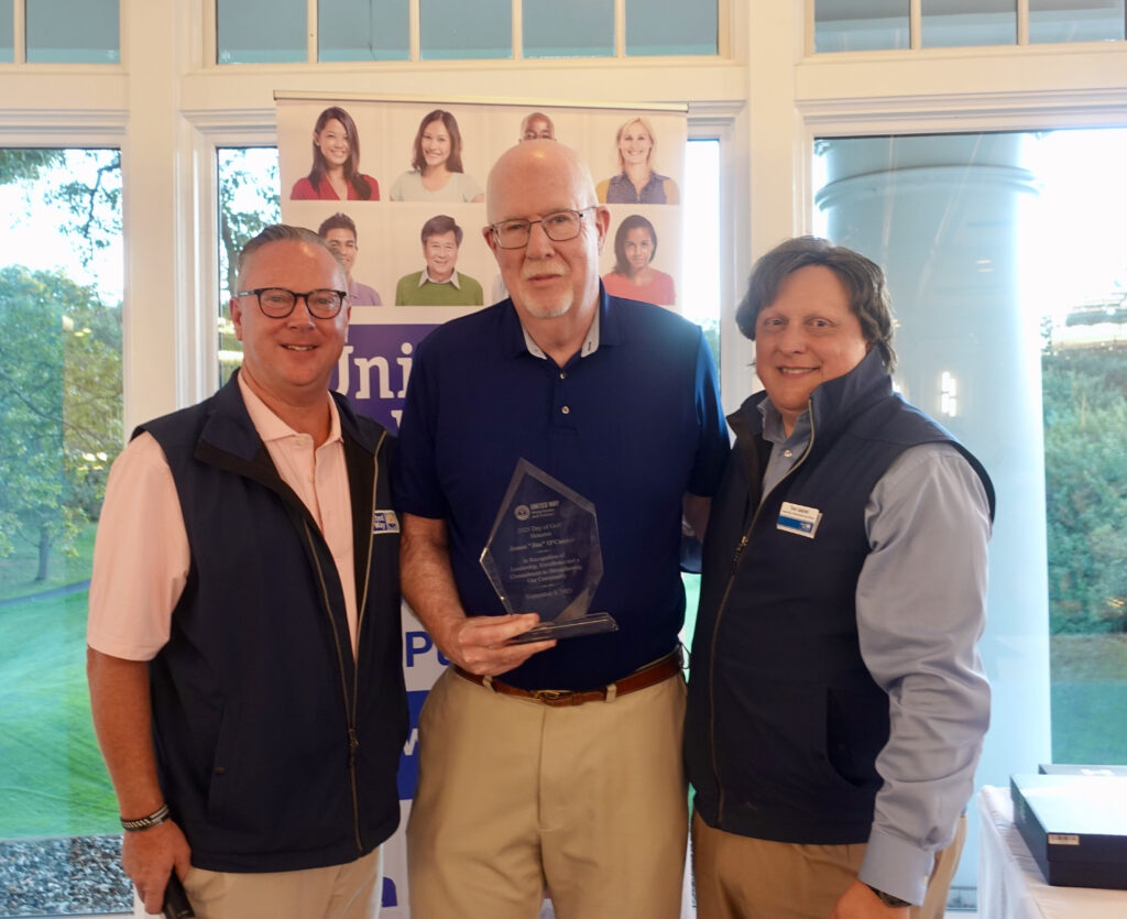 Jim O'Connor stands with the president and CEO of United Way of Westchester and Putnam Tom Gabriel and Bill Mooney, who serves on the board of the United Way of Westchester and Putnam.