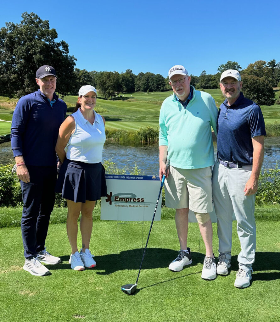 Jim O'Connor with his children on the green during the United Way's Day of Golf.