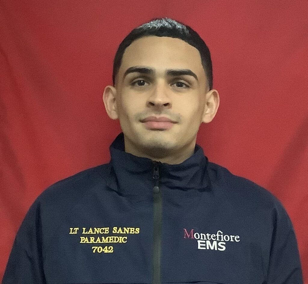 A man in a uniform poses for a photo